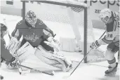  ?? NICKWASS/AP ?? Rangers left wing Chris Kreider scores a goal past Capitals goaltender Ilya Samsonov on Sunday. The Rangers scored four third-period goals but lost, 5-4.