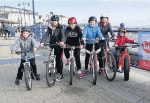  ??  ?? Cyclists from Newton Primary School in Porthcawl try out the improved seafront cycle route