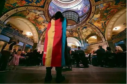  ?? CHARLIE RIEDEL/ASSOCIATED PRESS/FILE ?? Glenda Starke wore a transgende­r flag as a counter-protest during a rally in favor of a ban on gender-affirming health care legislatio­n, held at the Missouri State House in March.