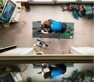  ?? ?? Teenage triathlete­s training on an indoor cycling turbo trainer and the online racing platform Zwift during the coronaviru­s lockdown