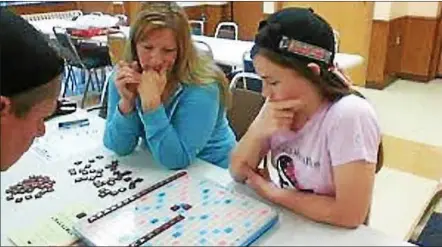  ?? FILE PHOTO ?? A team competes at the first Literacy Volunteers of Rensselaer County Scrabble Challenge.