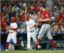  ?? MATT SLOCUM — THE ASSOCIATED PRESS ?? Washington Nationals relief pitcher Sean Doolittle, right, celebrates after winning a baseball game against the Philadelph­ia Phillies, Saturday in Philadelph­ia.