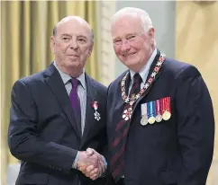  ?? — THE CANADIAN PRESS FILES ?? Hockey Night in Canada broadcaste­r Bob Cole, left, was awarded the Order of Canada by Governor General David Johnston in 2016, but has no interest in retiring from the job of calling hockey games.