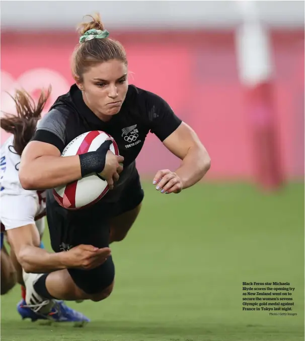  ?? Photo / Getty Images ?? Black Ferns star Michaela Blyde scores the opening try as New Zealand went on to secure the women’s sevens Olympic gold medal against France in Tokyo last night.