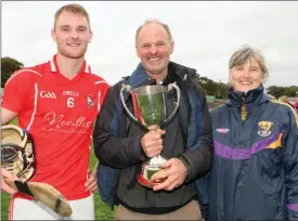  ??  ?? Fethard centre-back Kevin Rowe, great-grandson of 1917 captain Richie Rowe, with his proud parents, Vincent and Geraldine.