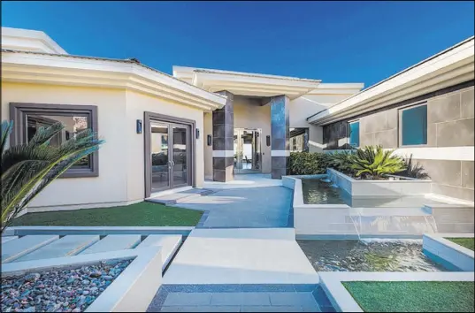  ?? Luxury Estates Internatio­nal ?? The 14,031-square-foot contempora­ry modern, two-story home was listed for $6,250,000 through Luxury Estates Internatio­nal. It recently sold for $5.5 million, according to listing agent Michael Zelina.