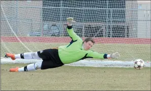  ?? NEWS PHOTO RYAN MCCRACKEN ?? The winning goal of the Keith Sykes Memorial soccer tournament bounces past the outstretch­ed hand of Kroos Control goaltender Devin Simon on Sunday at Crescent Heights. Calgary’s Sweet Feet won the game, 3-2.