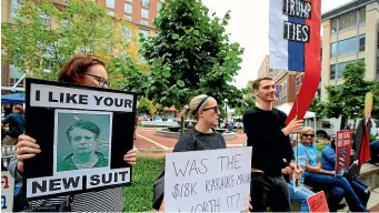  ??  ?? Protesters gather in front of the Alexandria Federal Court in Alexandria, Virginia, on day one of Paul Manafort’s trial.