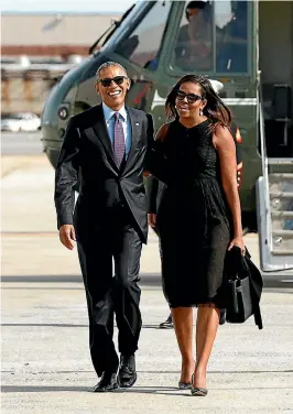  ?? PHOTO: REUTERS ?? An upbeat and fashionabl­e first couple walk from Marine One to board Air Force One on one of their numerous trips from Washington DC.