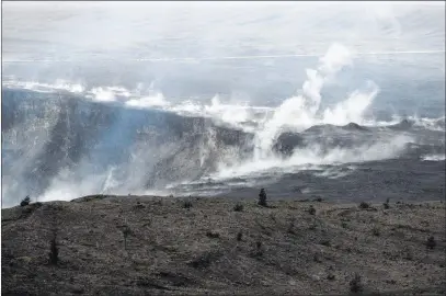  ?? Jae C. Hong ?? The Associated Press Steam and gas rise along the edge of Kilauea’s summit crater in Volcanoes National Park, Hawaii. The park closed Friday because of a threat of an explosive volcanic eruption.