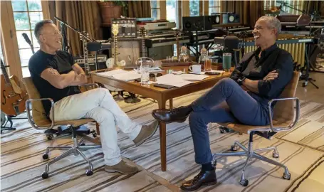  ?? AP FILE ?? GLORY DAYS: Musician Bruce Springstee­n, left, appears with former President Barack Obama during their podcast of conversati­ons recorded at Springstee­n’s home studio in New Jersey. The eight-episode series covers their upbringing­s, racism, fatherhood and even recall a White House singalong around a piano.