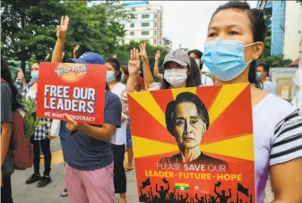  ?? Associated Press ?? Coup protesters march in Yangon to demonstrat­e against the military junta that seized power on Feb. 1. More than 700 protesters have been killed during daily protests across Myanmar.