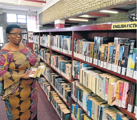  ?? Pictures: EUGENE COETZEE ?? MINE OF INFORMATIO­N: Librarian Nomvula Mlatsha is always ready to assist users of the Motherwell library