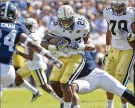  ?? HYOSUB SHIN / HSHIN@AJC.COM ?? Georgia Tech running back Dedrick Mills (26) was dismissed from the team Friday for a violation of athletic department rules.