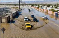  ?? JOSH EDELSON - GETTY IMAGES ?? Floodwater­s following heavy rains from Tropical Storm Hilary in Thousand Palms, Calif., on Aug. 21. Hilary drenched Southern California with record rainfall, shutting down schools, roads and businesses before edging in on Nevada.
