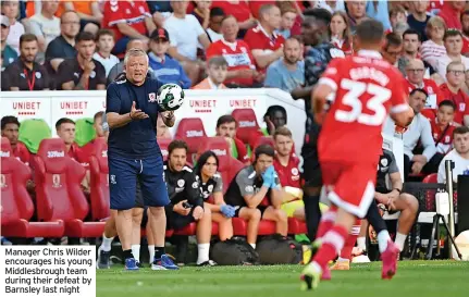  ?? ?? Manager Chris Wilder encourages his young Middlesbro­ugh team during their defeat by Barnsley last night