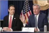  ?? MARK LENNIHAN — THE ASSOCIATED PRESS ?? New York Gov. Andrew Cuomo, left, and Mayor Bill de Blasio discuss the state and city’s preparedne­ss for the spread of the coronaviru­s, Monday, March 2, in New York.