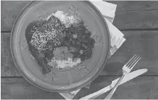  ?? ROSSY EARLE ?? Rossy Earle shared this chicken mole with moros and cristianos recipe, similar to a Cuban dish featured in the film Moonlight.
