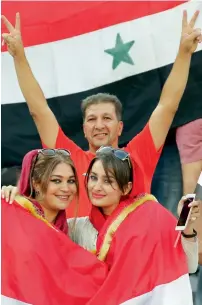  ?? —AFP ?? Supporters of Syria cheer for their team during the Fifa World Cup 2018 qualificat­ion football match between Iran and Syria at the Azadi Stadium in Tehran on September 5.