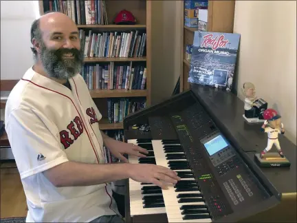  ?? MARY EATON VIA THE ASSOCIATED PRESS ?? In an April 2020 photo provided by Josh Kantor, the Boston Red Sox organist plays the organ in his home in Cambridge, Mass.