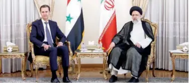  ?? Agence France-presse ?? ↑
Ebrahim Raisi (right) holds a meeting with Bashar Al Assad in Tehran on Sunday.