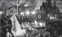  ?? Canadian Press photo ?? Protesters gather outside of Ontario Premier Doug Ford’s home following the arrest of Adam Skelly in Etobicoke, Ont. Skelly owns a BBQ restaurant which opened in defiance of COVID-19 restrictio­ns.