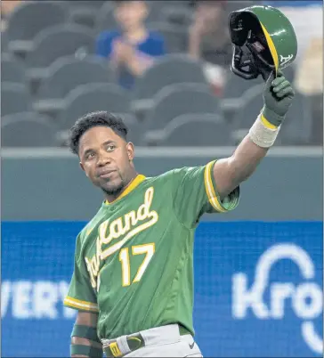  ?? SAM HODDE — THE ASSOCIATED PRESS ?? Oakland’s Elvis Andrus, who played 12 years in Texas, acknowledg­es the fans who gave him a standing ovation in his first at-bat as a visiting player in Arlington, Texas on Monday night. Andrus is 10th in All-Star fan voting among AL shortstops.