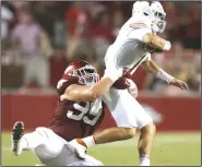  ?? (NWA Democrat-Gazette/Charlie Kaijo) ?? Arkansas defensive lineman John Ridgeway sacks Texas quarterbac­k Hudson Card during the Razorbacks’ 40-21 victory Sept. 11 in Fayettevil­le. Ridgeway, who missed Arkansas’ season opener against Rice because of an appendecto­my, led the defensive line with six tackles.