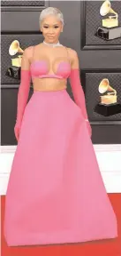  ?? ?? << Saweetie sported Valentino hot pink gown and matching gloves at Grammy 2022