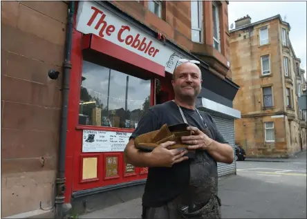  ??  ?? Cobbler Gerry Fleming outside his shop, which has become a local institutio­n over 31 years in Govanhill