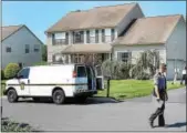  ?? DIGITAL FIRST MEDIA FILE PHOTO ?? Police gather outside the Perkiomen Township home where the 54-year-0ld homeowner was stabbed to death in the early-morning hours of Friday, July 21.