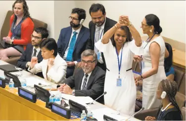  ?? Mary Altaffer / Associated Press ?? Costa Rican Ambassador Elayne Whyte Gomez, president of the U.N. Conference to Negotiate a Legally Binding Instrument to Prohibit Nuclear Weapons, reacts after the vote to prohibit nuclear weapons.