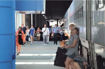  ?? MICHAEL SEARS / MILWAUKEE JOURNAL SENTINEL ?? Amtrak Hiawatha passengers arrive from Chicago in Milwaukee and enter the Intermodal Station on Wednesday.