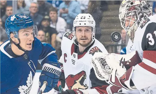  ?? NATHAN DENETTE THE CANADIAN PRESS ?? Leafs winger Zach Hyman, who scored twice, was a handful for Coyotes goalie Adin Hill at Scotiabank Arena on Tuesday night.