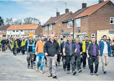  ??  ?? All for one: 90 local tradespeop­le in Hull helped the family of a paralysed roofer