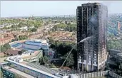  ?? ALASTAIR GRANT/AP ?? Firefighte­rs continue workingWed­nesday to put out a deadly fire in a London high-rise apartment block.