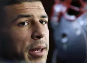  ?? ELISE AMENDOLA - THE ASSOCIATED PRESS ?? FILE - In this Sept. 5, 2012file photo, New England Patriots tight end Aaron Hernandez speaks in the locker room at Gillette Stadium in Foxborough, Mass.