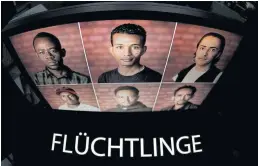  ?? EPA ?? A computer screen displays the German word ‘Fluechtlin­ge’ (Refugees), the German word of the year, with a photo of refugees at the Austrian-German border near Weigscheid, Germany.