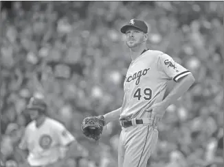  ?? Associated Press ?? Chicago White Sox starting pitcher Chris Sale looks around Wrigley Field during the first inning of a baseball game against the Chicago Cubs Thursday in Chicago.