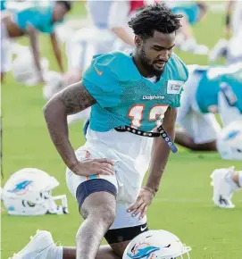  ?? Wilfredo Lee/Associated Press ?? Miami Dolphins wide receiver Jaylen Waddle stretches out before a joint practice with the Atlanta Falcons at the NFL football team’s training facility on Wednesday in Miami Gardens, Fla. Waddle was later injured.