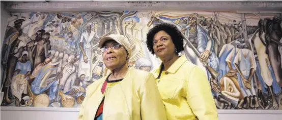  ?? Steve Gonzales / Houston Chronicle ?? Charlotte Kelly Bryant, left, and Lucy Bremond hope to preserve the Blue Triangle Multi-Cultural Associatio­n’s building and John Biggers’ mural.