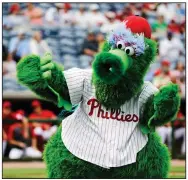  ?? (AP/Frank Franklin II) ?? The Phillie Phanatic mascot performs before a spring training baseball game against the Toronto Blue Jays in Clearwater, Fla., in February. MLB wants to ban mascots — at least this season, should baseball resume — but mascots remained a staple of baseball games in Taiwan and the KBO League in South Korea.