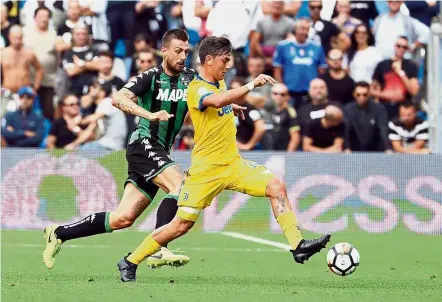  ?? — AP ?? Too hot to handle: Juventus’ Paulo Dybala controllin­g the ball during the Serie A match against Sassuolo at the Mapei Stadium in Reggio Emilia, Italy, on Sunday.