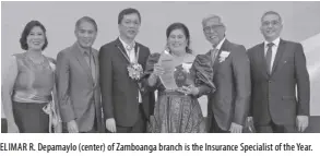  ?? ?? ELIMAR R. Depamaylo (center) of Zamboanga branch is the Insurance Specialist of the Year.