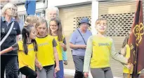  ??  ?? ●● The Mayor was accompanie­d by a samba band, and representa­tives from the Brownies, guides and cadets