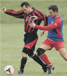  ??  ?? Red House WMC Over-40s (red and black) battle Penshaw Catholic Club
