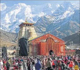  ?? HT PHOTO ?? (Above) Devotees during opening of the portals of Kedarnath shrine on Sunday; and (right) a seer during the ceremony.