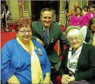  ?? PHOTO PROVIDED ?? Carol Hotaling of Rexford, left, spearheade­d efforts to get Yellow Ribbon Day establishe­d in New York State. The state Assembly and Senate passed resolution­s recently to recognize her efforts. Hotaling is joined by Clifton Park Supervisor Phil Barrett,...