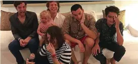  ??  ?? Fun: Mick and his sons roar laughing apart from 19-month-old Deveraux who doesn’t see the funny side in youngest daughter Georgia May’s snap. Below, ar snap posted by the eldest, Jade