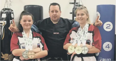  ??  ?? Medallist Casey Stone, Sensei Andrew Hicks and instructor Miss Atlanta Hickman, who is now a double world champion